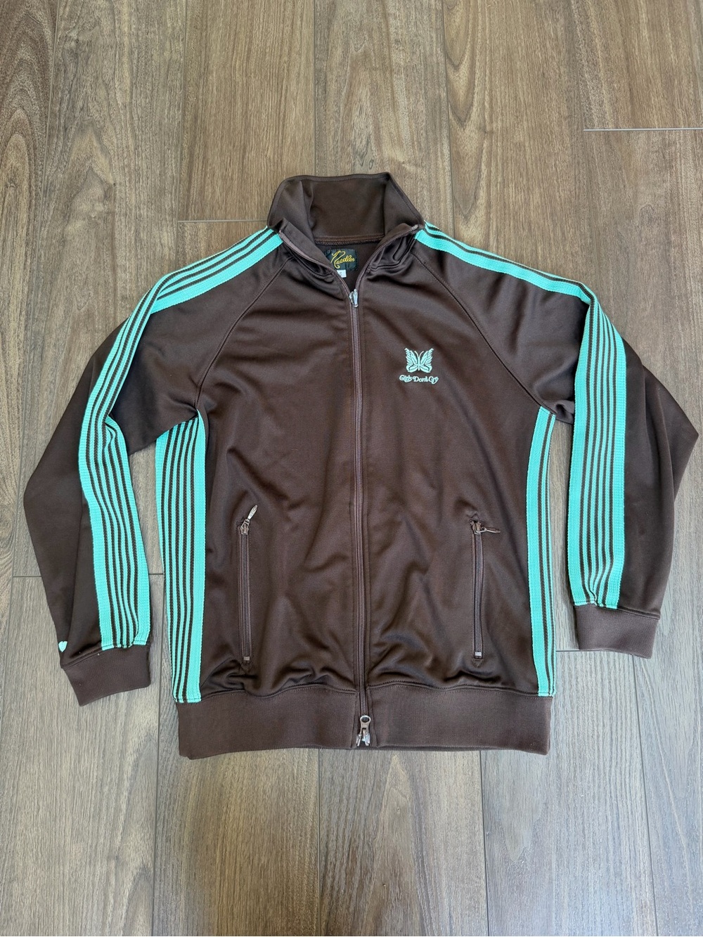 Needles x Girls Don’t Cry Collab Brown Track Jacket with Teal Stripes